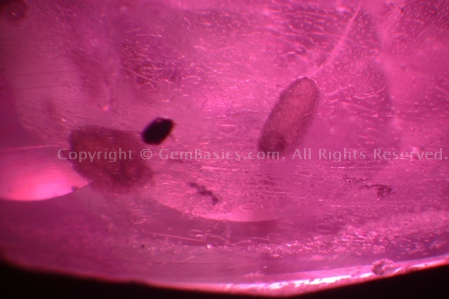 Glassy residues in magmatic ruby